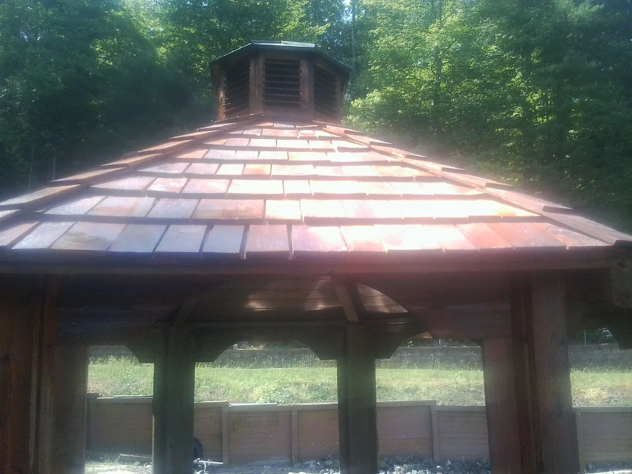New cedar shake roof and cupola on a lakeside gazebo in Kimbolton